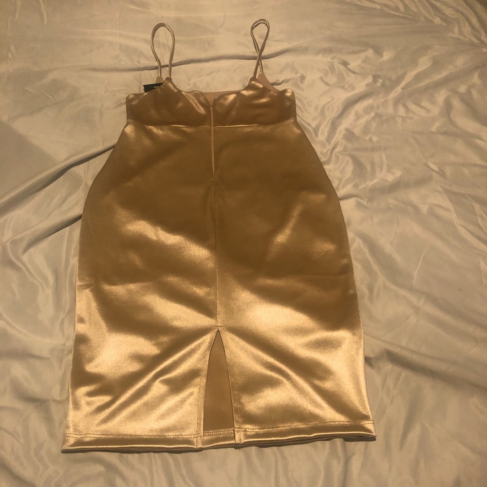 Gold high wasted body con dress .